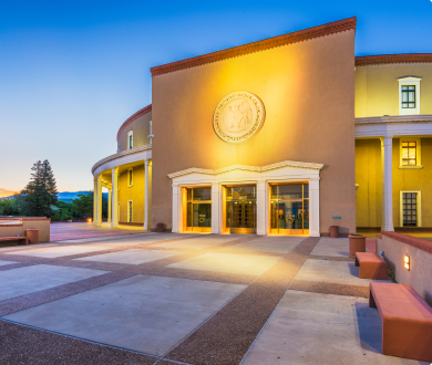 Great Seal of the State of New Mexico logo in a building