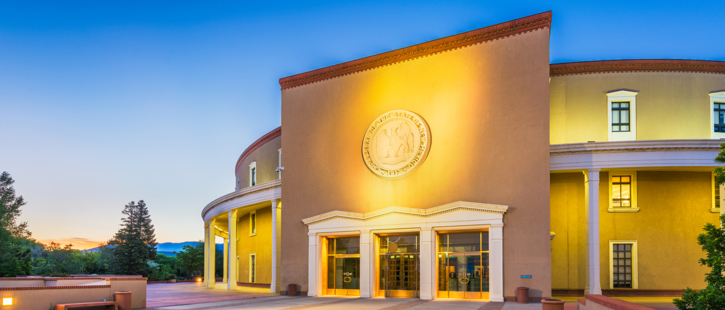 Great Seal of the State of New Mexico logo in a building